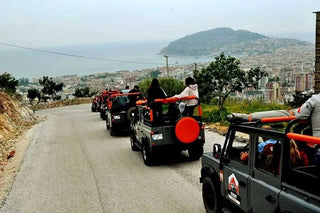 People riding Jeeps