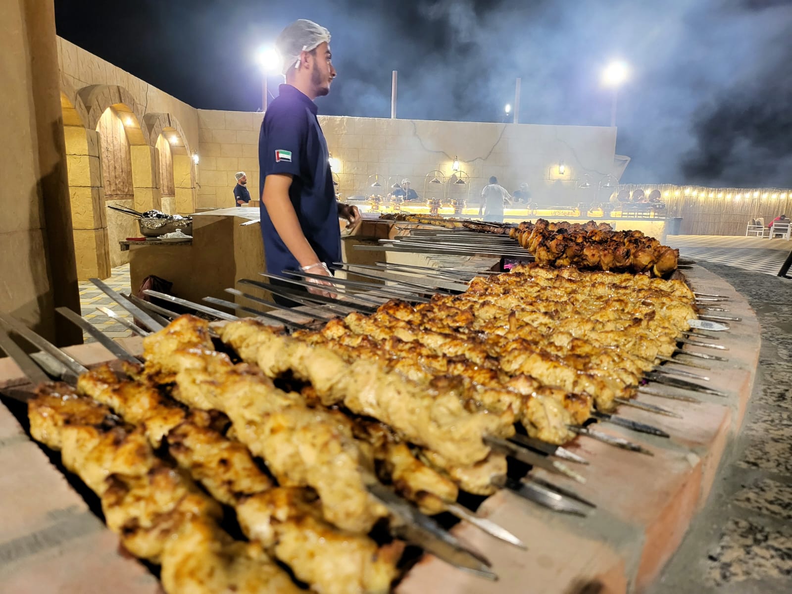 Delicious gourmet BBQ dinner setup at a premium desert safari camp.