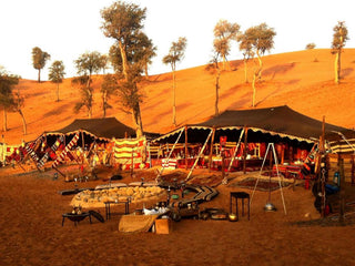 traditional Bedouin-style tent setup in a desert environment