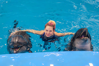 Sidesvømning med delfiner med eksperttrænere og transport