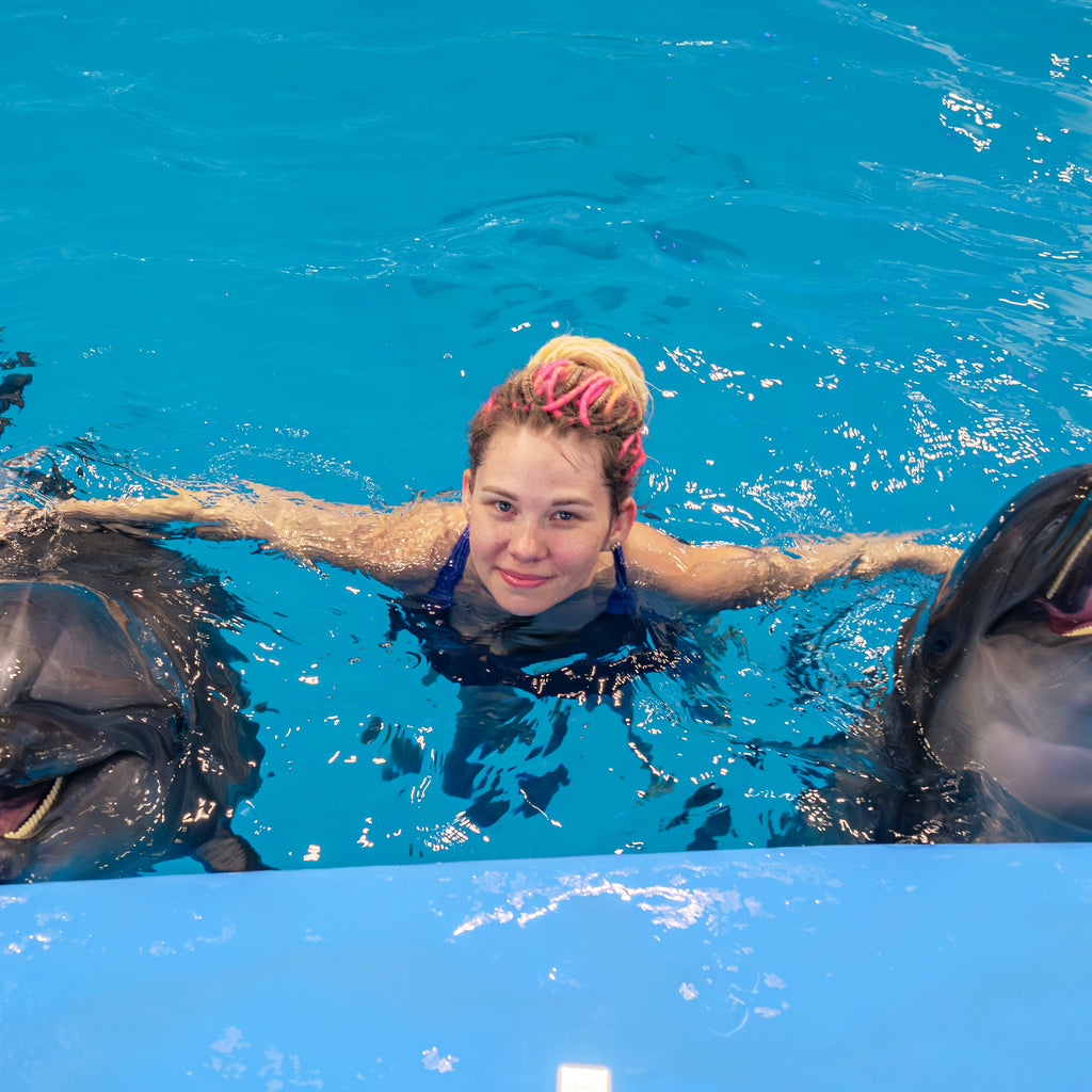 Sidesvømning med delfiner med eksperttrænere og transport