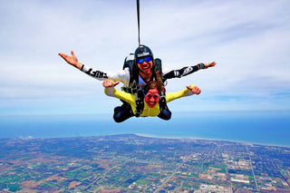 Tandem skydiving, an exhilarating sport involving jumping from sky