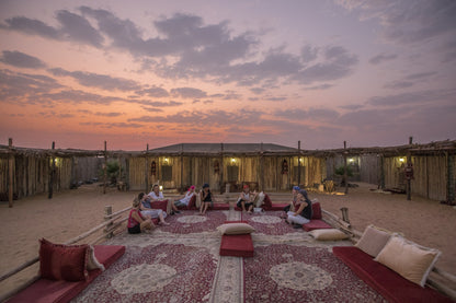 Guests stargazing in the tranquil desert night as part of the heritage safari.