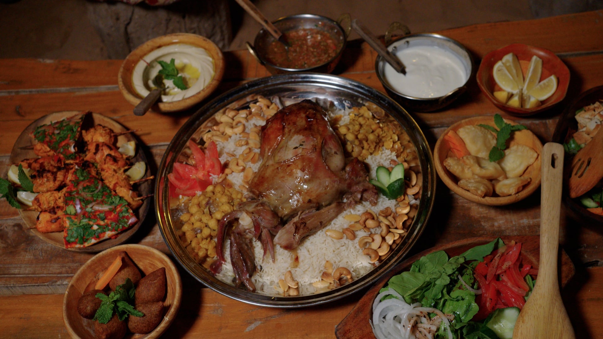 A traditional Emirati dinner served at the heritage camp under the stars.